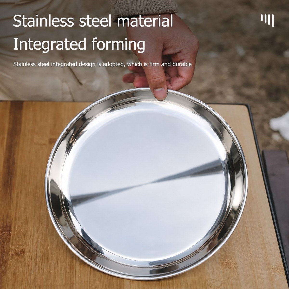 Stainless steel plate held over a wooden table